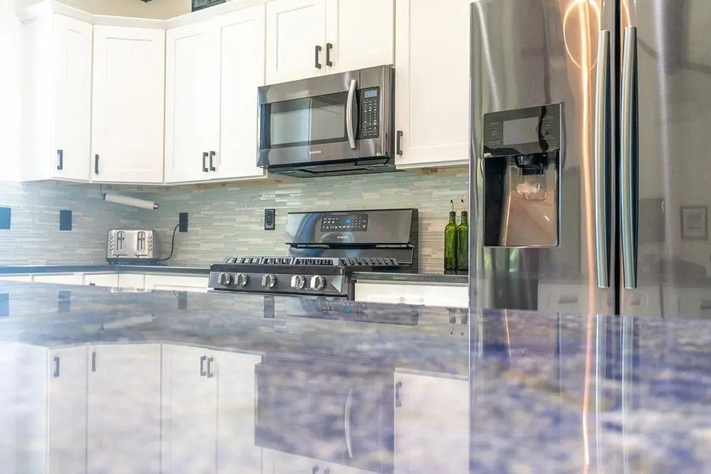 Blue Bahia Granite Kitchen Countertops with White Cabinets